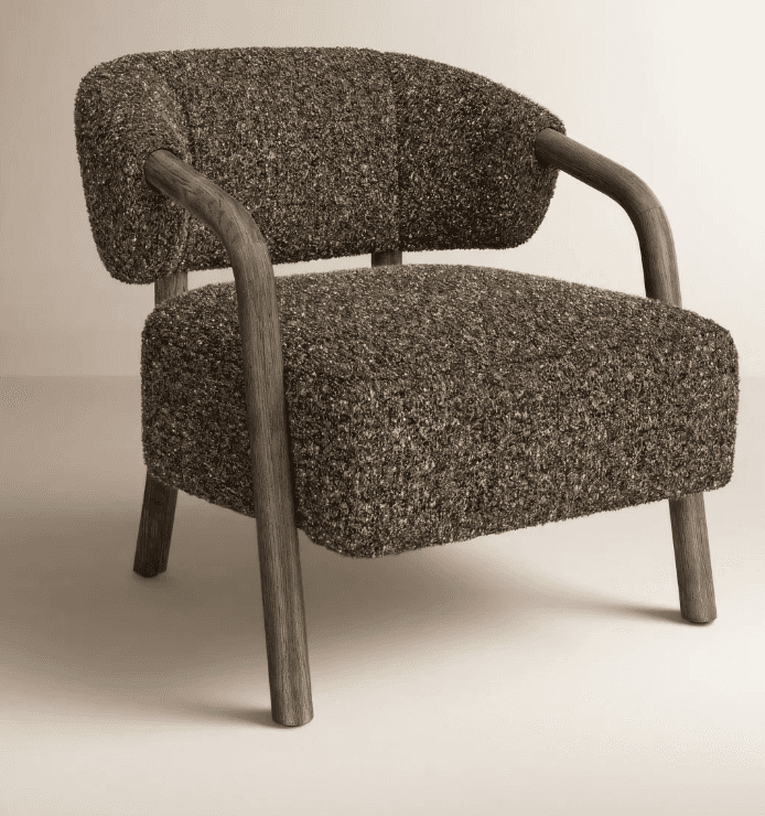 A contemporary accent chair featuring a chunky, textured dark grey and brown bouclé-like upholstery… — 3D model