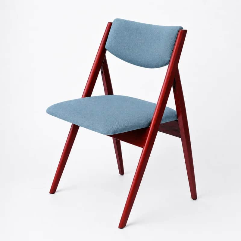 An armless chair featuring a reddish-brown stained wooden frame with a light blue upholstered seat a… — 3D model