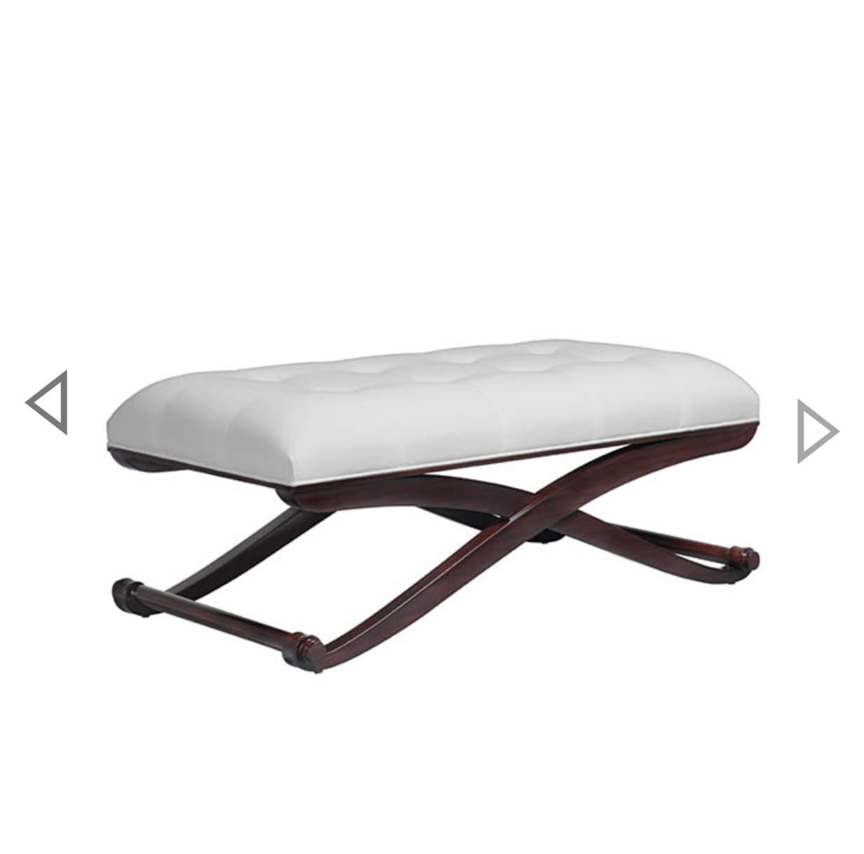 A rectangular, upholstered ottoman bench featuring a tufted white cushion and a dark brown, X-shaped wooden base. The base includes turned stretcher bars connecting the two X-frames. — 3D model