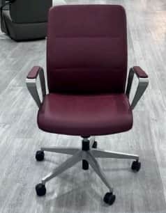 A contemporary office armchair featuring burgundy upholstered seat and backrest, complemented by sle… — free OBJ 3D model
