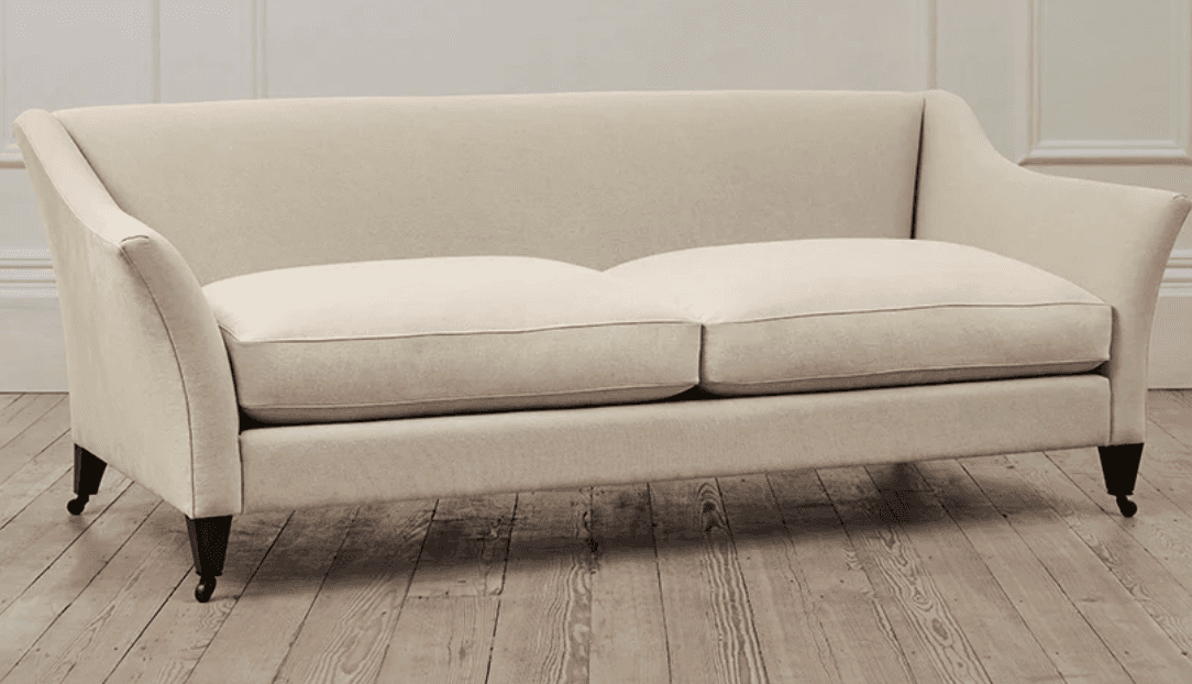 A two-seater sofa upholstered in a light beige or off-white fabric. It features a classic design wit… — 3D model