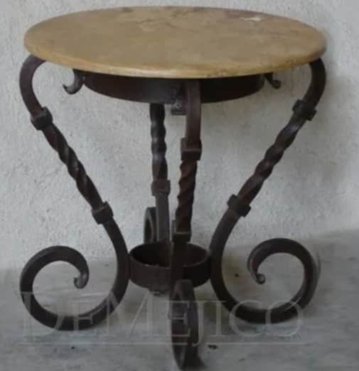 A round-top side table with a cream-colored, possibly stone or composite, surface. The base is const… — 3D model