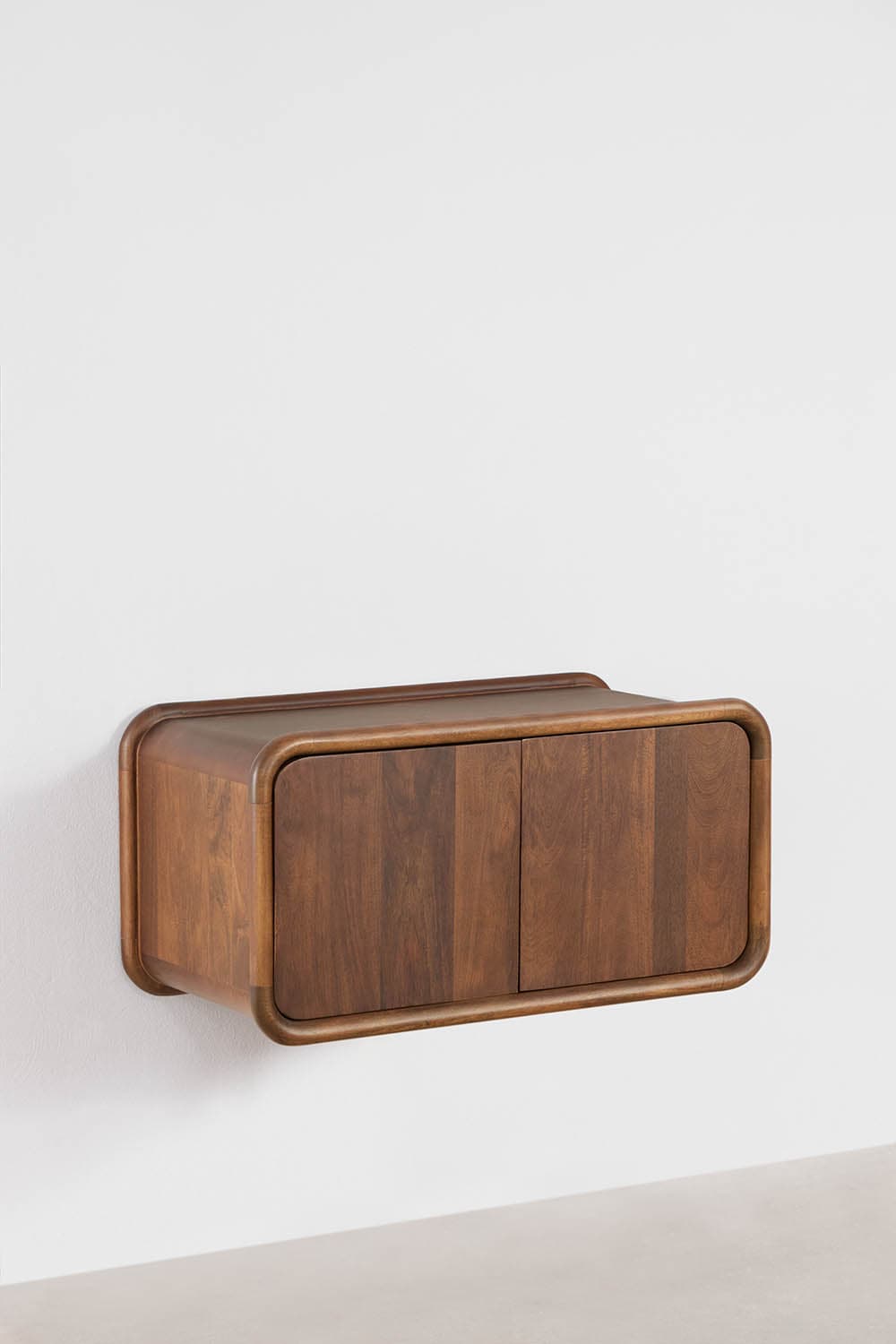 A wall-mounted cabinet made of dark wood, featuring a rectangular form with smoothly rounded edges on all sides. It has two vertical doors on the front that are flush with the frame, showcasing a natural wood grain. The cabinet appears to float, being securely affixed to a light-colored wall. — 3D model