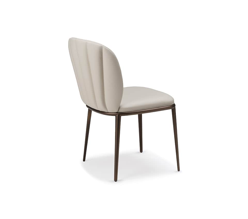 An elegant contemporary dining chair featuring a slender profile, upholstered in a light cream or of… — 3D model