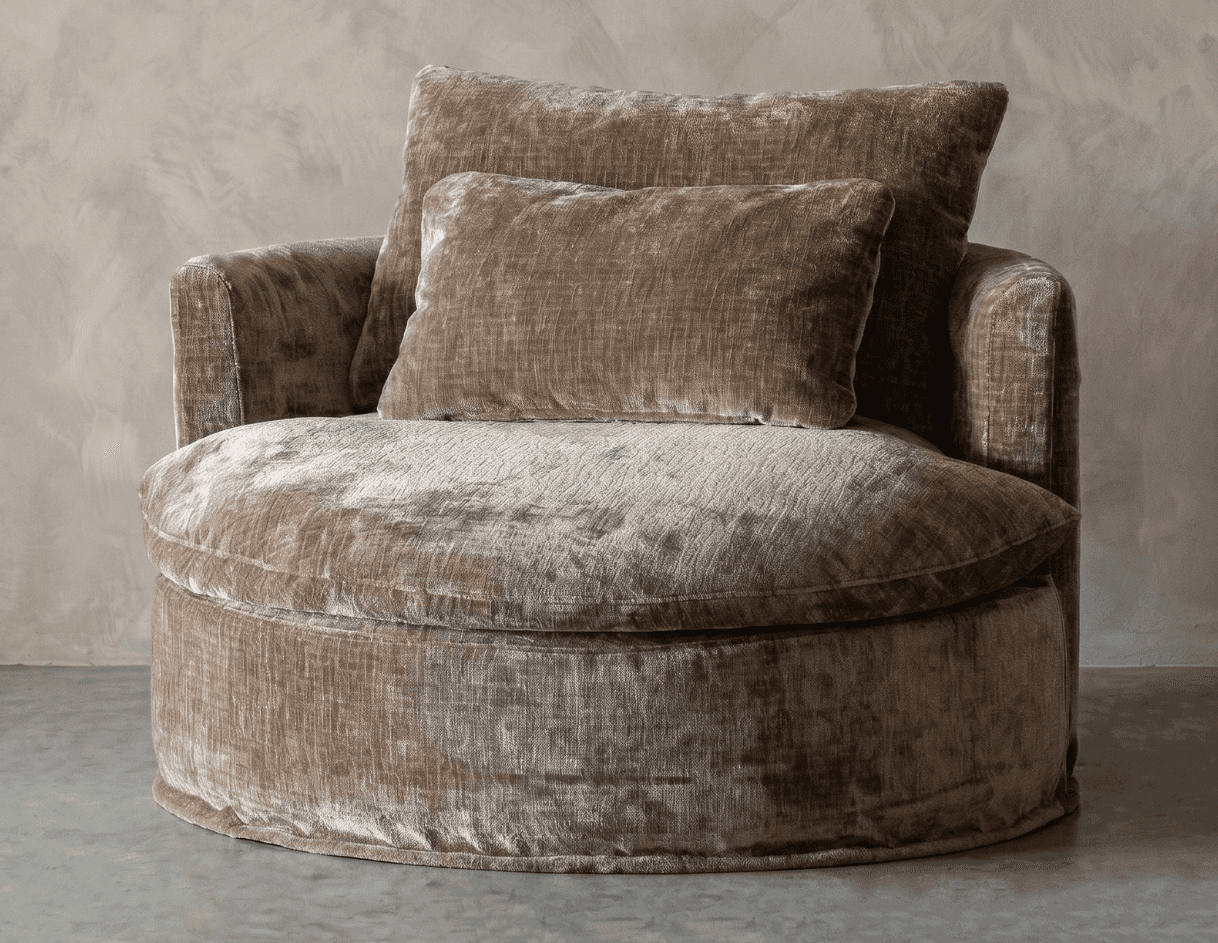 An oversized, round lounge chair upholstered in a plush, textured taupe velvet fabric. The chair fea… — 3D model