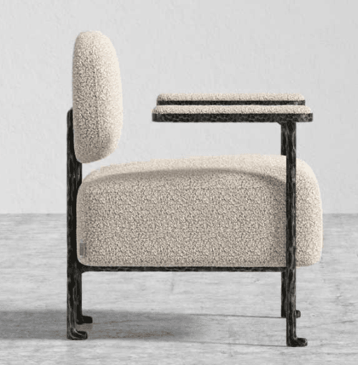 A single accent chair with a textured, bouclé upholstery on the seat, back, and armrests. The frame and legs are made of dark metal with a visible hammered texture. — 3D model