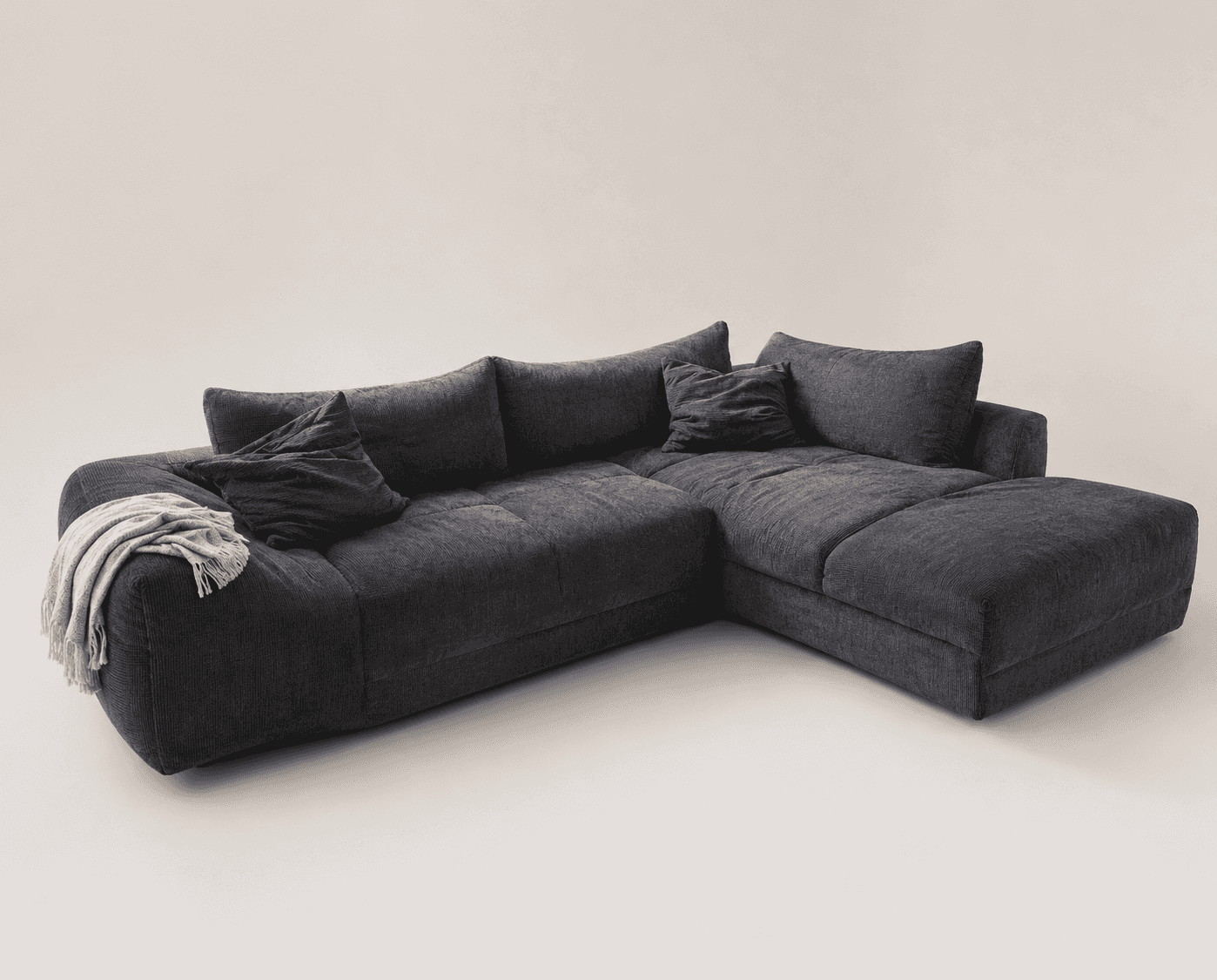 A large, dark gray L-shaped sectional sofa upholstered in a textured fabric, possibly corduroy or ch… — free OBJ 3D model