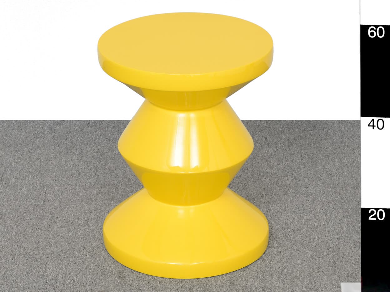 A bright yellow, hourglass-shaped stool with a glossy finish. The stool features a flat top surface and a wide base, with two bulbous sections connected by narrower, curved midsections. It appears to be made of a solid material, possibly plastic or lacquered wood. — 3D model