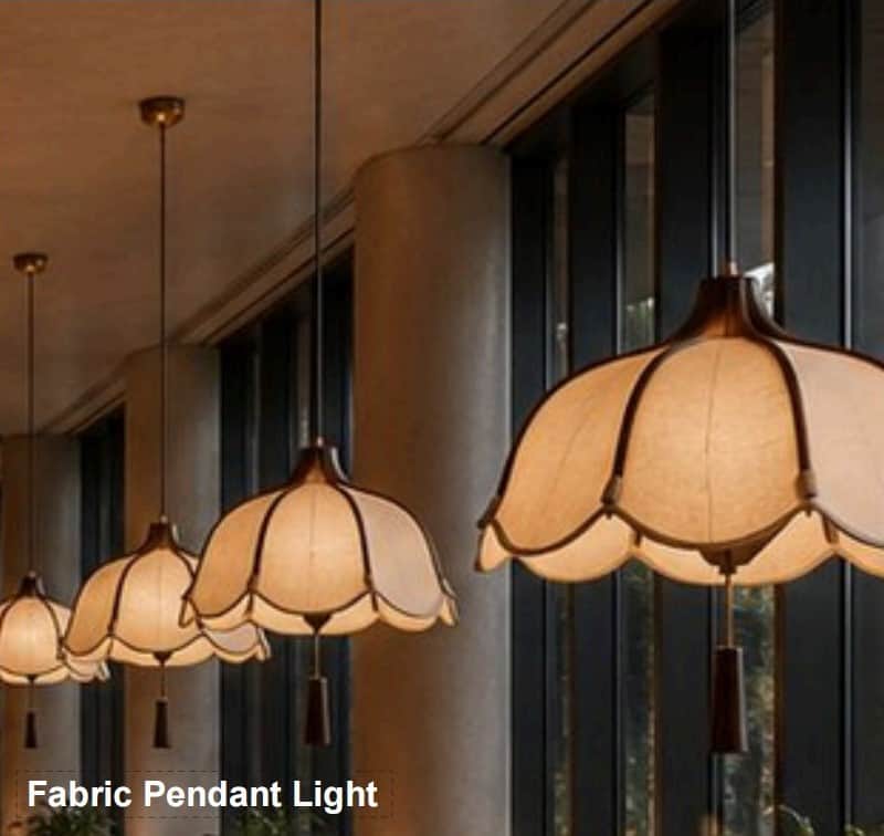 A pendant light featuring a distinctive scalloped fabric shade suspended from a dark metal rod. The… — 3D model