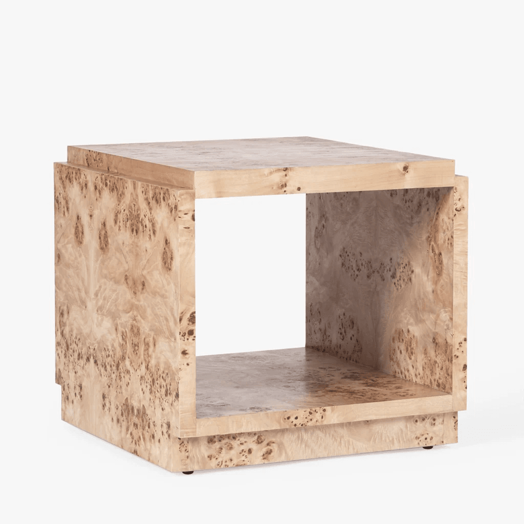 A contemporary cube-shaped side table crafted from light-toned burl wood veneer, featuring an open central compartment for storage or display. — 3D model