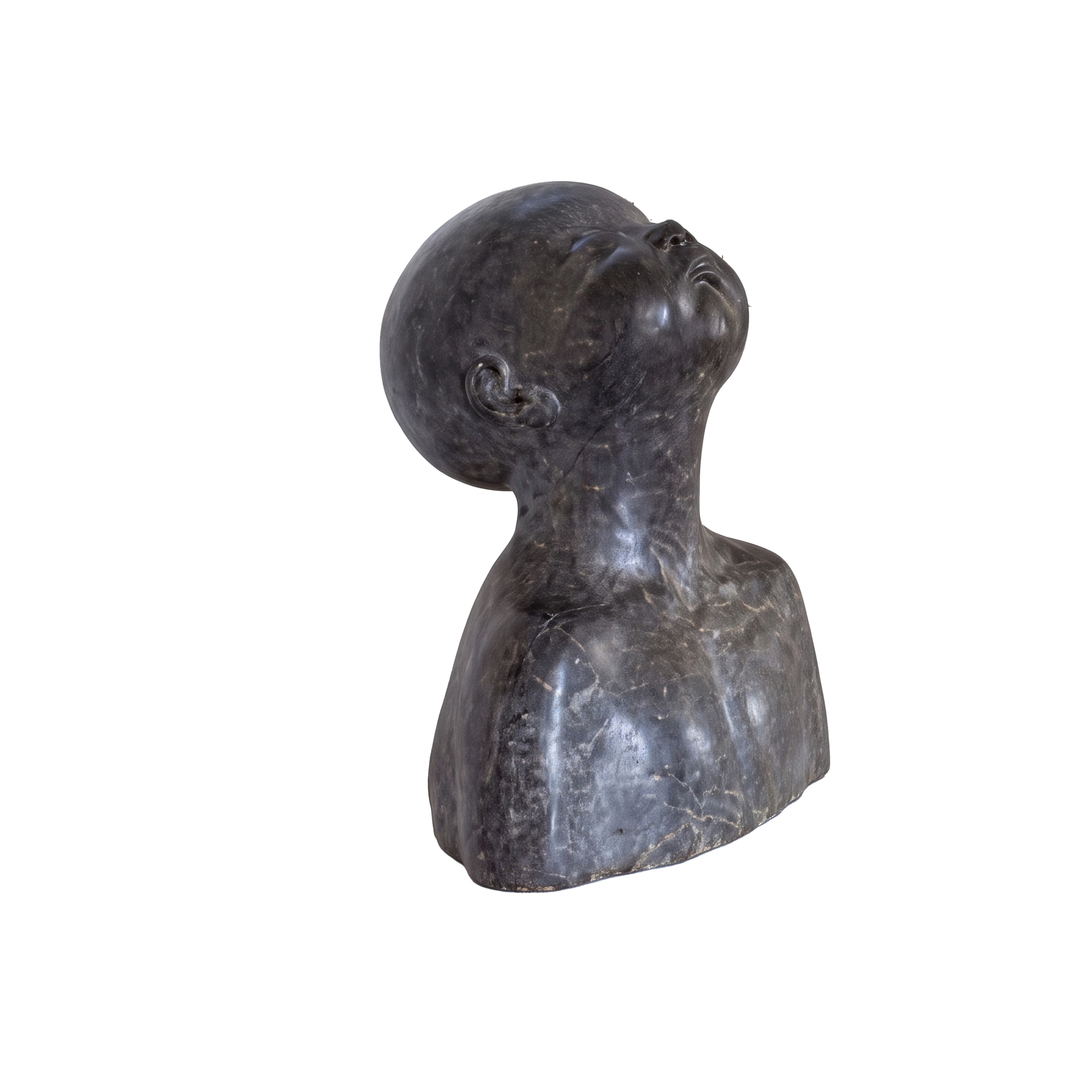 A dark-toned, stylized bust sculpture depicting a human head and partial upper torso, with the head tilted upwards and the gaze directed skyward. The material appears to be a dark stone with subtle veining and a matte finish. — 3D model