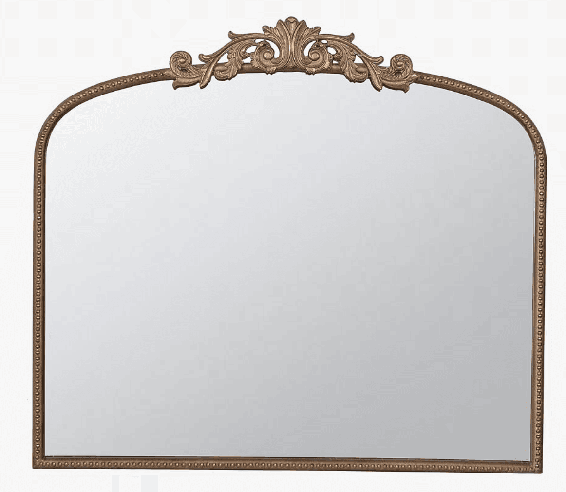 An ornate wall mirror with an arched top and a richly decorated frame. The frame features an intricately carved crest at its apex with scrolled acanthus leaf motifs, an antique bronze finish, and an inner beaded trim along the perimeter. The mirror provides clear reflection. — 3D model