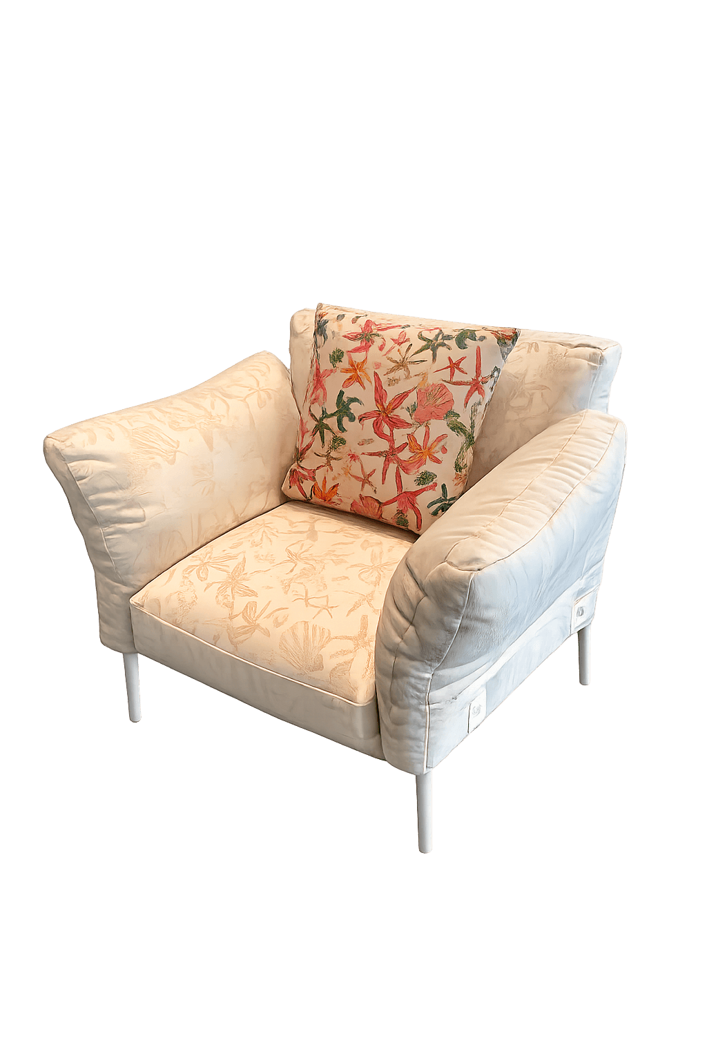 A single-seat armchair with a predominantly white upholstery. The seat and backrest are adorned with a subtle, tone-on-tone pattern of seashells and marine life. The armrests are wide and padded, featuring a quilted texture. The chair is supported by four slender, white legs. A decorative throw pillow with a colorful starfish motif is placed on the seat. — 3D model