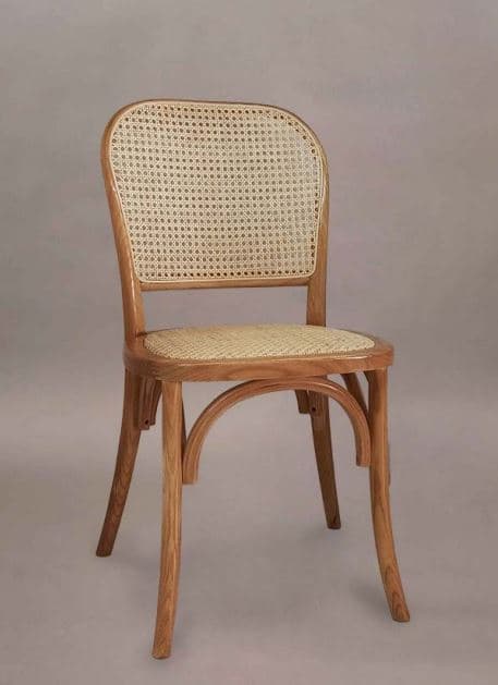 A bentwood chair with a curved backrest and seat, both featuring woven cane material. The chair has four legs, with the front legs extending upwards to support the seat and the back legs continuing to form the curved backrest. There is an arched stretcher connecting the front legs just below the seat. — 3D model
