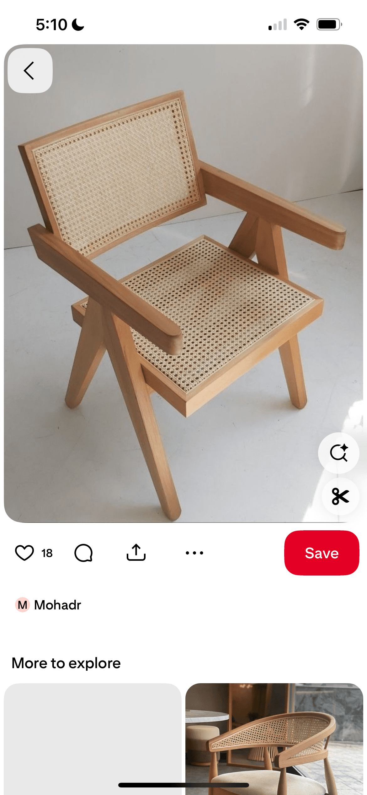 A modern armchair constructed with a light-toned wooden frame and featuring woven cane webbing on both the backrest and the seat. The chair has a geometric design with straight, angular armrests and legs. — 3D model