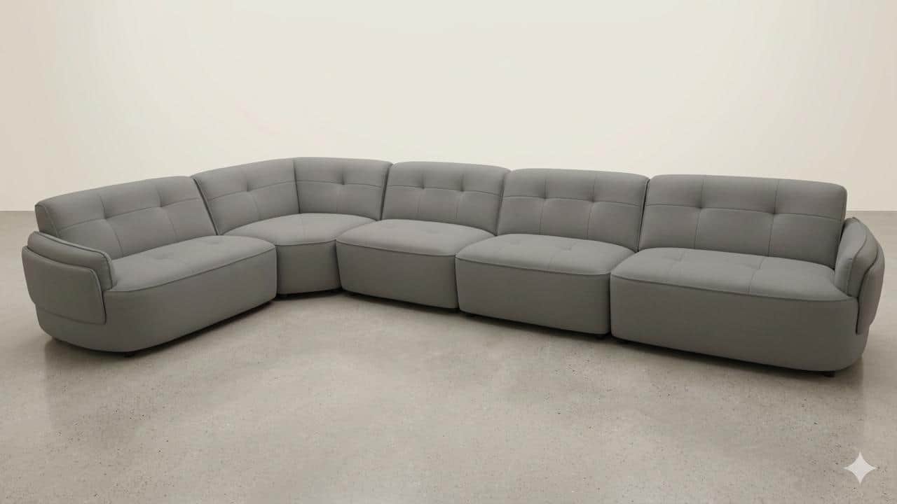 A modular sectional sofa with a curved configuration, upholstered in a grey fabric. The sofa consist… — free GLTF 3D model