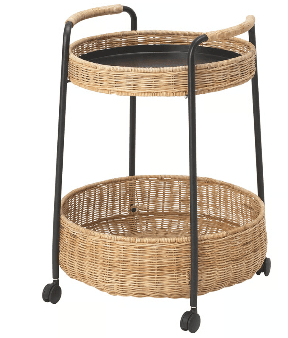 A two-tiered serving or bar cart featuring a black metal frame, two circular natural wicker woven baskets, and caster wheels. The top basket incorporates a removable black metal tray. The frame extends upwards to form integrated curved handles, wrapped in matching wicker. — 3D model