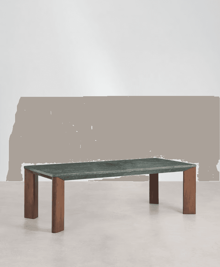 A modern dining table with a rectangular top made of green veined marble and four rectangular wooden legs. The legs are positioned towards the interior of the tabletop, creating a minimalist aesthetic. The marble has a polished finish and exhibits natural variations in color and pattern. — 3D model