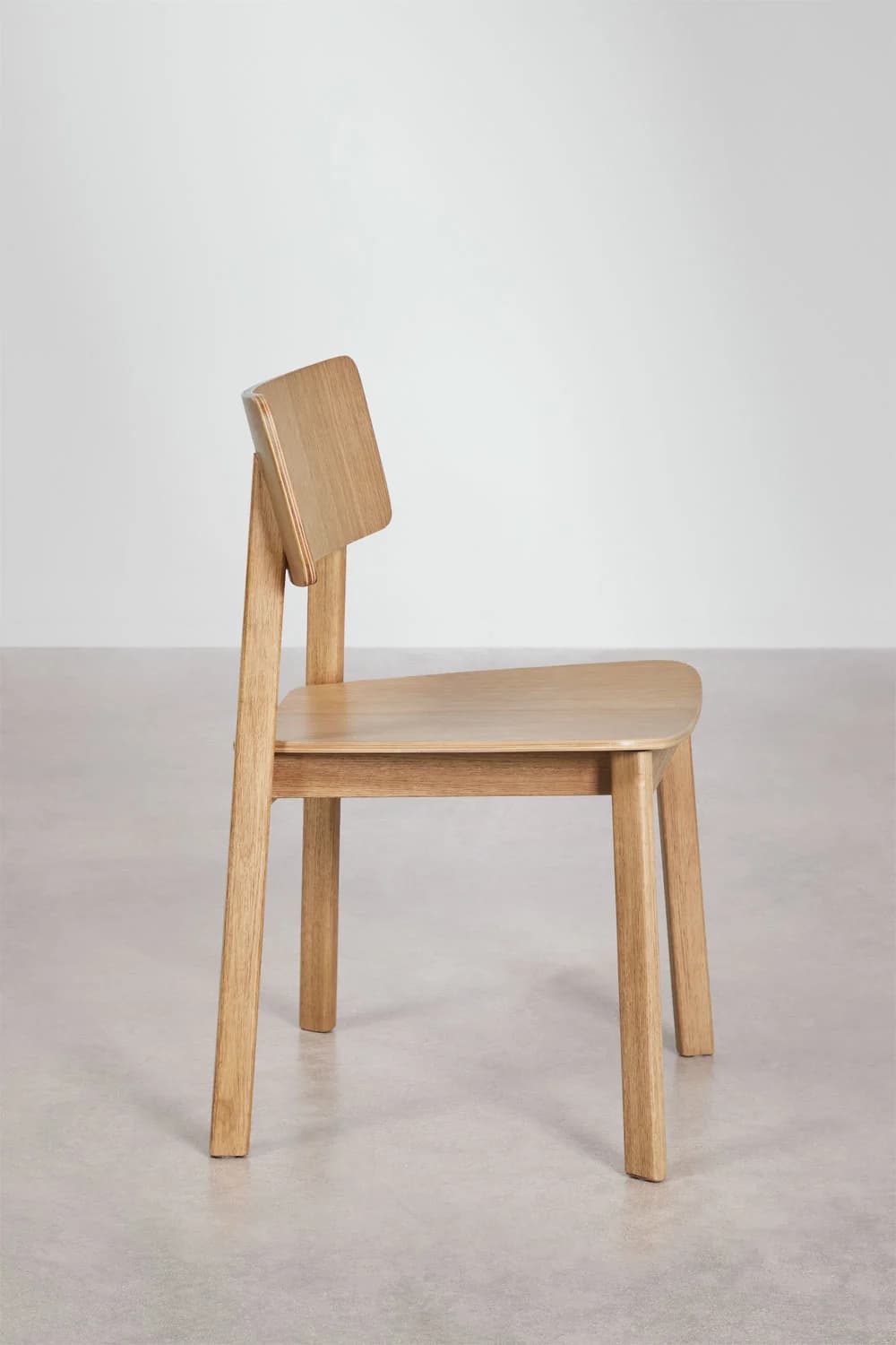A modern, minimalist side chair constructed from light-colored solid wood, featuring a flat seat and a curved backrest attached to the rear legs. — 3D model