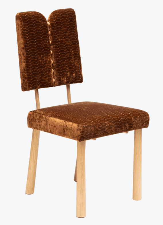 A side chair with a distinct backrest design that appears to be split or curved inwards at the top.… — 3D model