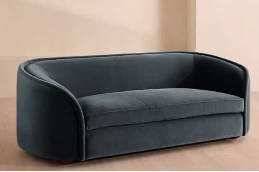 A modern two-seater loveseat, upholstered in a deep teal velvet, featuring a continuous curved back… — 3D model