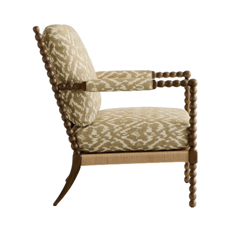 An upholstered armchair featuring a distinctive spool-turned wooden frame, ikat-patterned fabric, and a rope-wrapped seat base. — 3D model