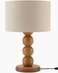A contemporary table lamp featuring a natural light-toned wood base composed of three stacked spheri… — 3D model