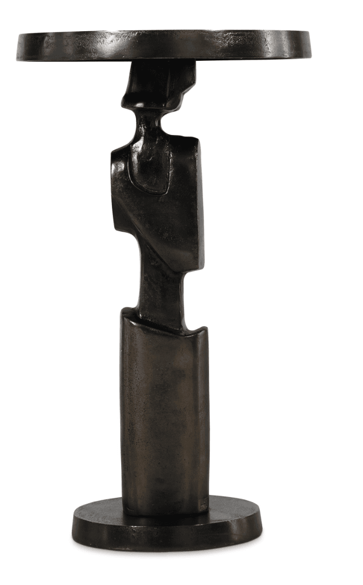 A small, dark bronze accent table featuring an abstract, sculptural base reminiscent of a stylized human figure. It has a circular top and a matching circular base, with the central column forming the artistic, multi-faceted body. The finish is a deep, dark brown-black with a matte, slightly textured patina. — 3D model