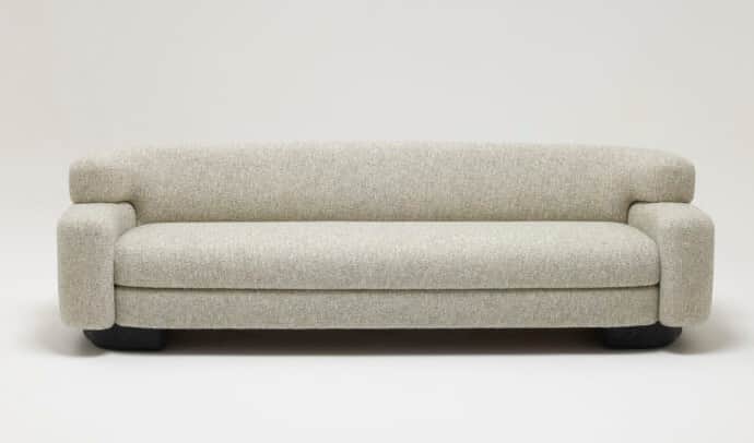 A contemporary sofa featuring a sleek, minimalist design with soft, rounded edges. It is upholstered… — 3D model