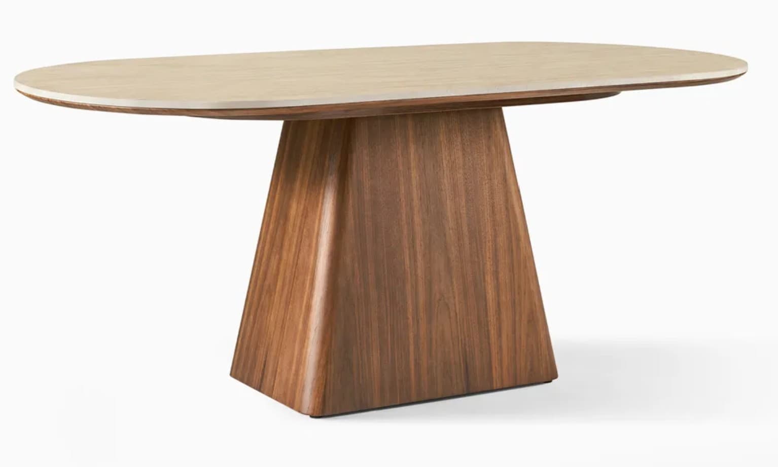 An oval-shaped dining table featuring a light-colored, possibly stone or composite, tabletop with rounded edges. The tabletop rests on a substantial, single pedestal base made of dark brown wood with a visible grain, likely walnut veneer. The base has a unique, tapered trapezoidal form, wider at the bottom and narrowing towards the top, with softly rounded vertical edges. The overall design is sleek, modern, and minimalist, emphasizing clean lines and natural materials. — 3D model
