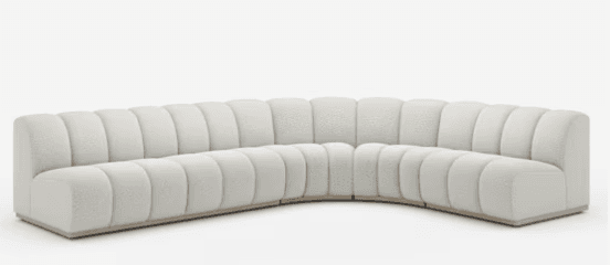 A large, modern, curved modular sectional sofa featuring distinctive channel tufting across its backrest and seat, upholstered in a light, textured fabric and supported by a minimalist wooden plinth base. — 3D model