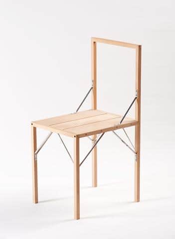 A light-toned wooden folding chair featuring a slatted seat and an open, rectangular backrest, with… — free STL 3D model