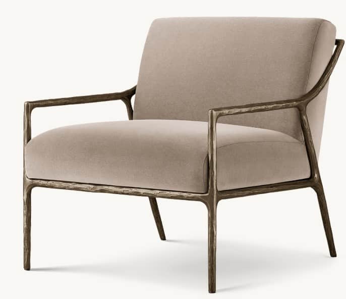 A contemporary armchair with a striking, organic-inspired metal frame and upholstered seat and back.… — 3D model