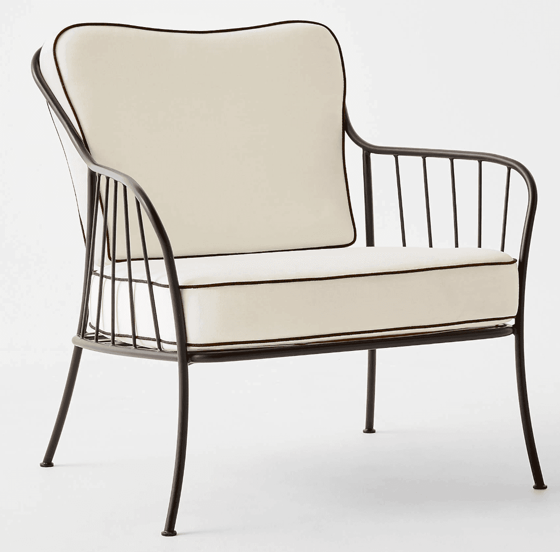 A contemporary armchair featuring a slender black metal frame and two plush, off-white upholstered c… — 3D model