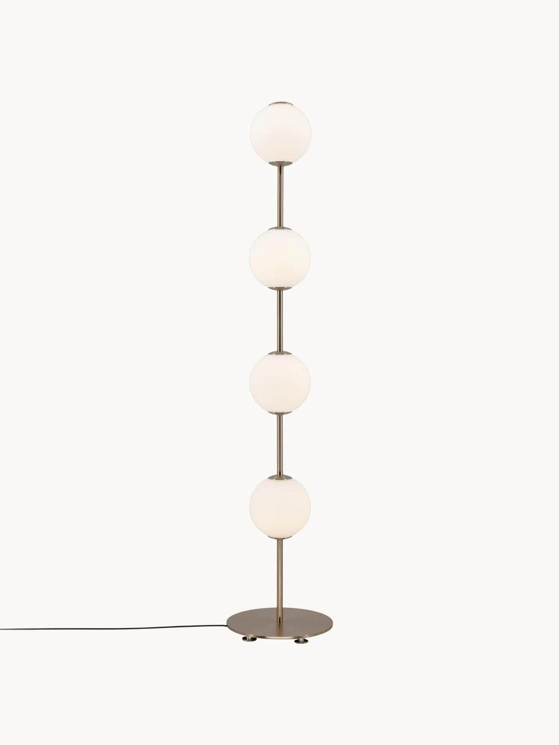 A floor lamp with a circular base, a vertical stem, and four spherical white frosted glass shades st… — 3D model
