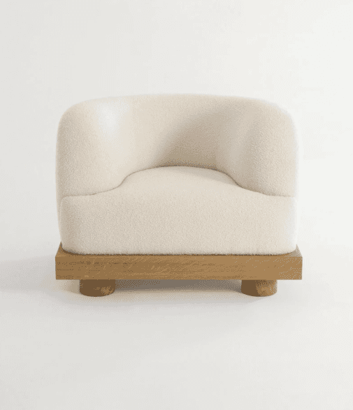 A contemporary armchair with a rounded, upholstered seat and back, supported by a distinct wooden ba… — free OBJ 3D model
