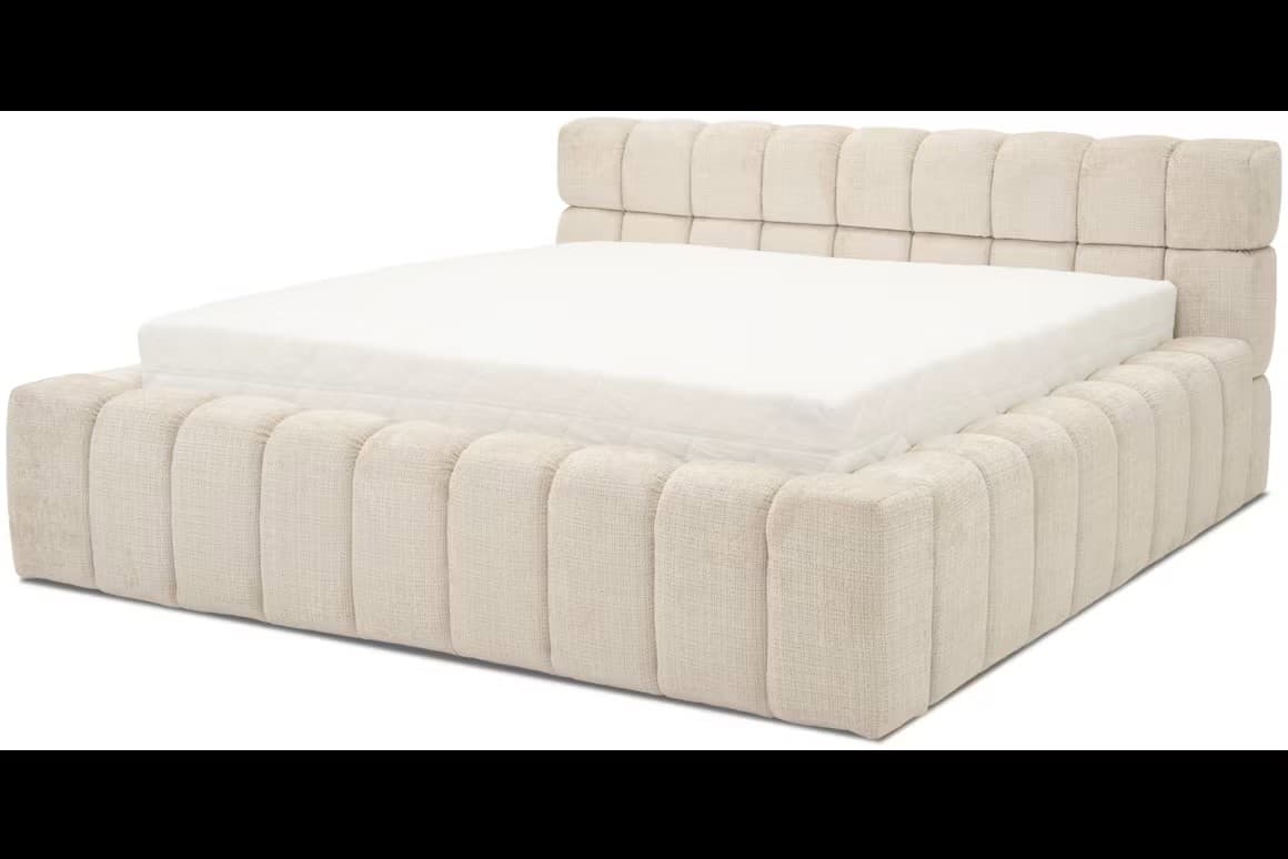 A contemporary platform bed featuring a low-profile design and fully upholstered frame and headboard with distinctive vertical channel tufting, rendered in a light beige textured fabric. — 3D model