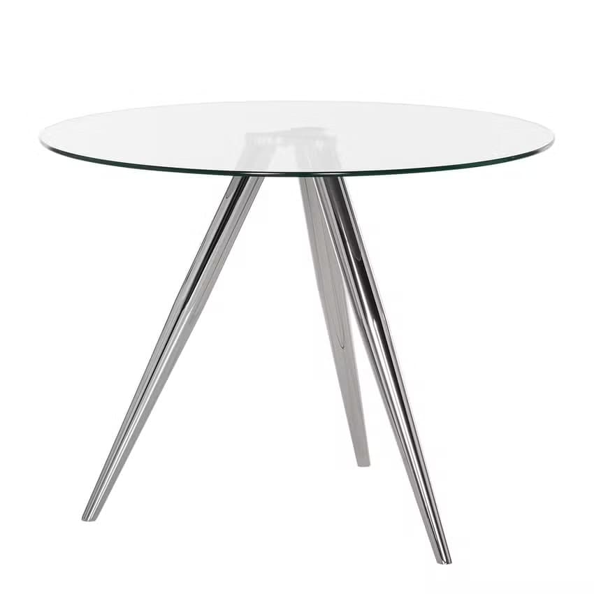 A modern dining table featuring a circular clear glass tabletop supported by a splayed tri-leg base made from polished chrome-plated steel. — 3D model