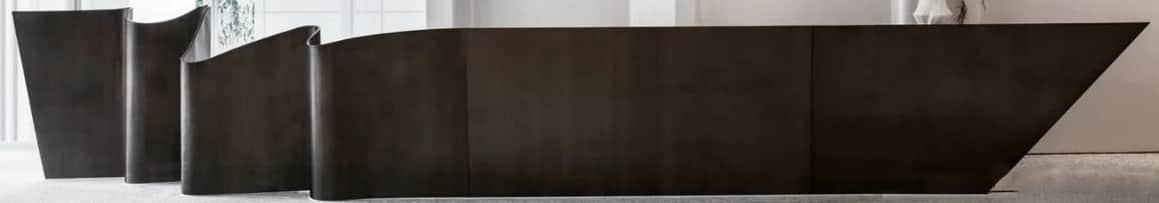 An elongated, low-profile credenza featuring a distinctive undulating or wavy front facade. The piec… — 3D model