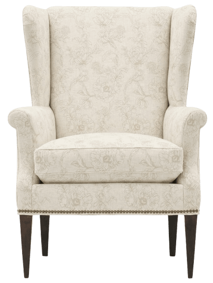 A high-backed armchair, commonly known as a wingback chair, upholstered in a light-colored fabric with a subtle floral pattern. The chair features a distinct winged silhouette at the back, extended armrests, and a plush seat cushion. Decorative nailhead trim accents the base of the chair, and it is supported by dark, tapered legs. — 3D model