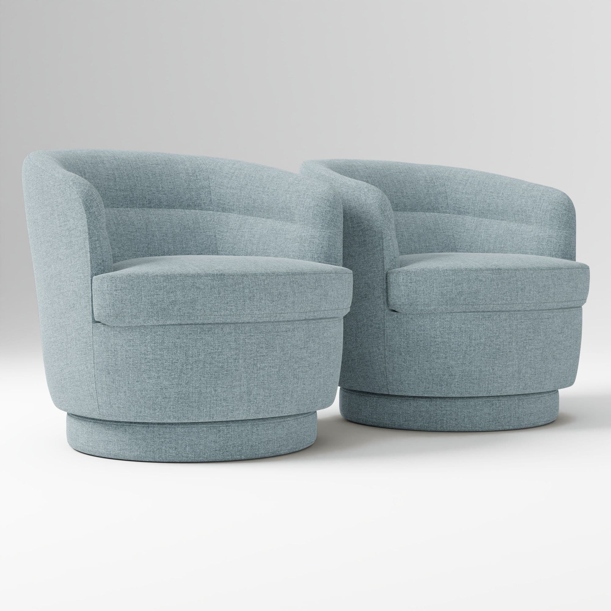 A contemporary upholstered swivel chair featuring a rounded, compact silhouette. It has integrated arms that flow seamlessly from the low backrest, which shows subtle horizontal channel tufting. The chair is covered in a textured light blue fabric and sits on a matching drum-shaped swivel base. — 3D model