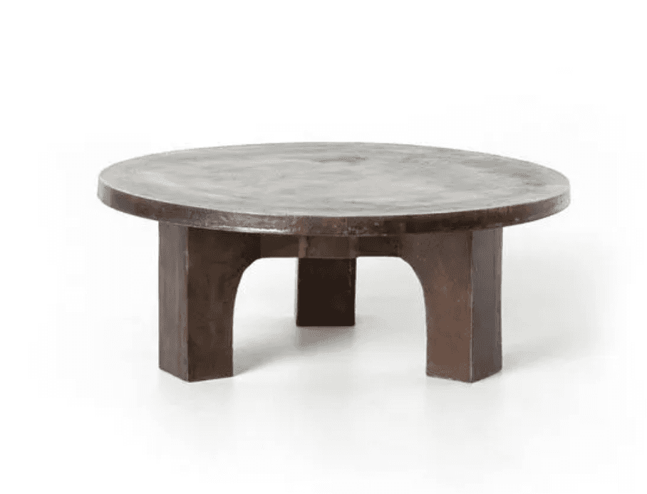A low, round coffee table featuring a thick, circular top and sturdy, block-like legs, all finished… — free SKP 3D model