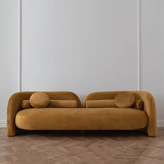 A contemporary asymmetrical chaise lounge featuring a sculptural form, upholstered in a mustard yell… — 3D model