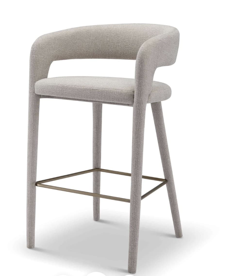 A modern bar stool with a curved backrest and armrests, upholstered in a textured fabric. It features four slender legs connected by a horizontal footrest. The design is minimalist with a focus on form and material. — 3D model