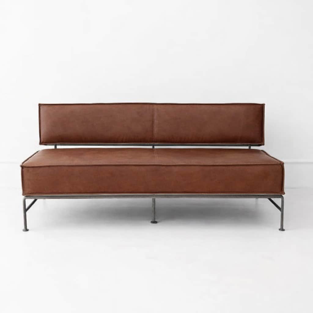 A modern two-seater sofa with a metal frame and brown leather upholstery. The sofa features a low-pr… — free GLTF 3D model