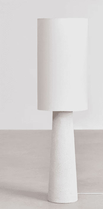 A modern table lamp with a cylindrical white lampshade and a tapered, textured white base. The base… — 3D model