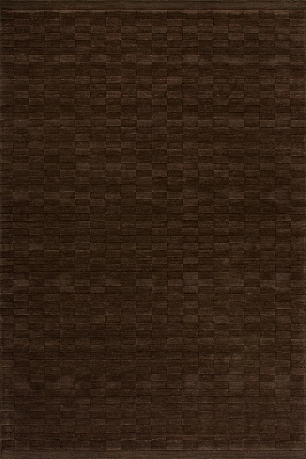 A dark brown, rectangular rug with a subtle textured pattern. The pattern appears to be a grid of small, raised squares or diamonds, creating a tactile surface. The rug is shown from an isometric perspective, with its edges clearly defined. — 3D model