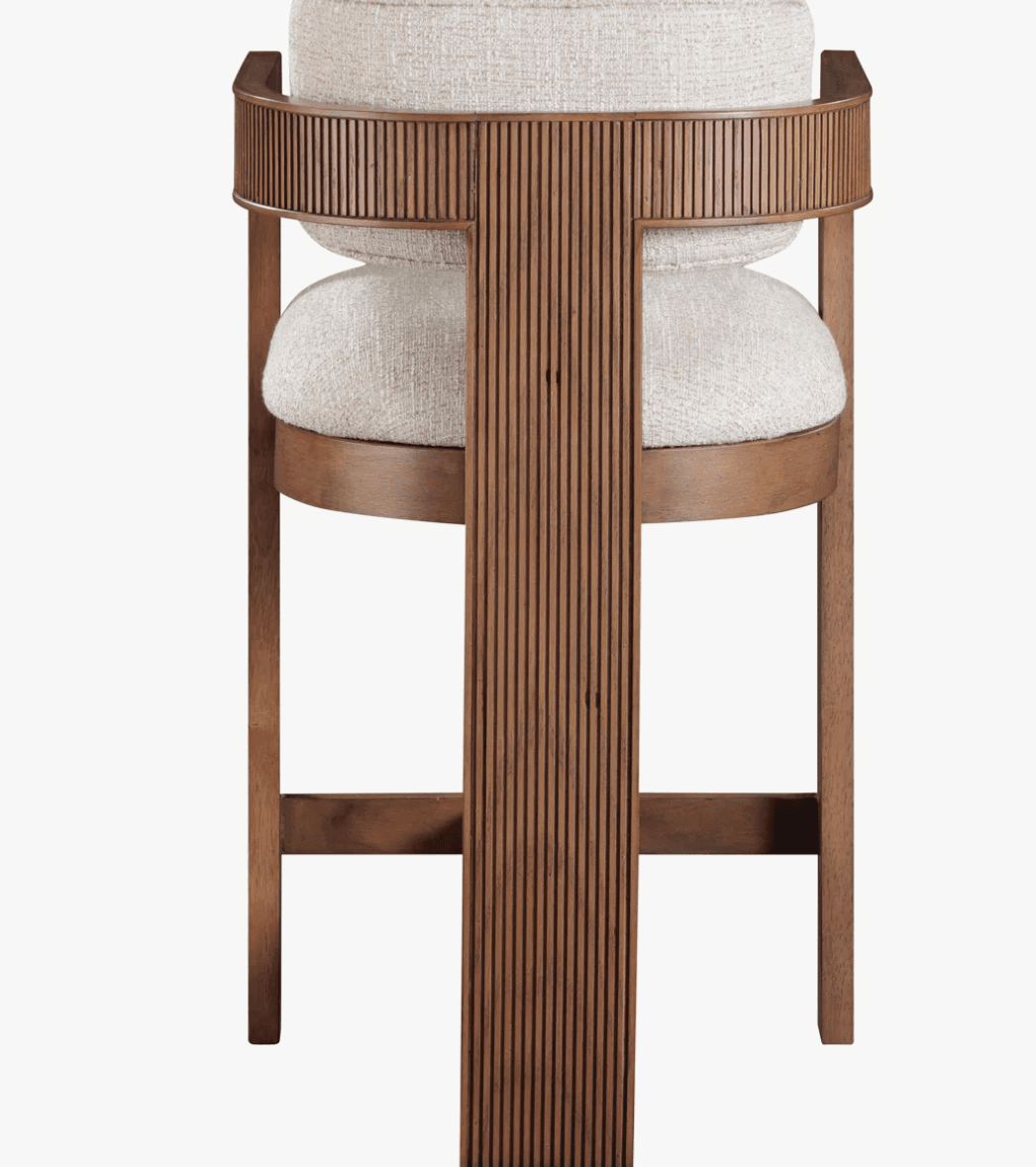 A modern wooden bar stool featuring a fluted backrest and upholstered seat and back cushions, designed for use at a bar or counter. — 3D model