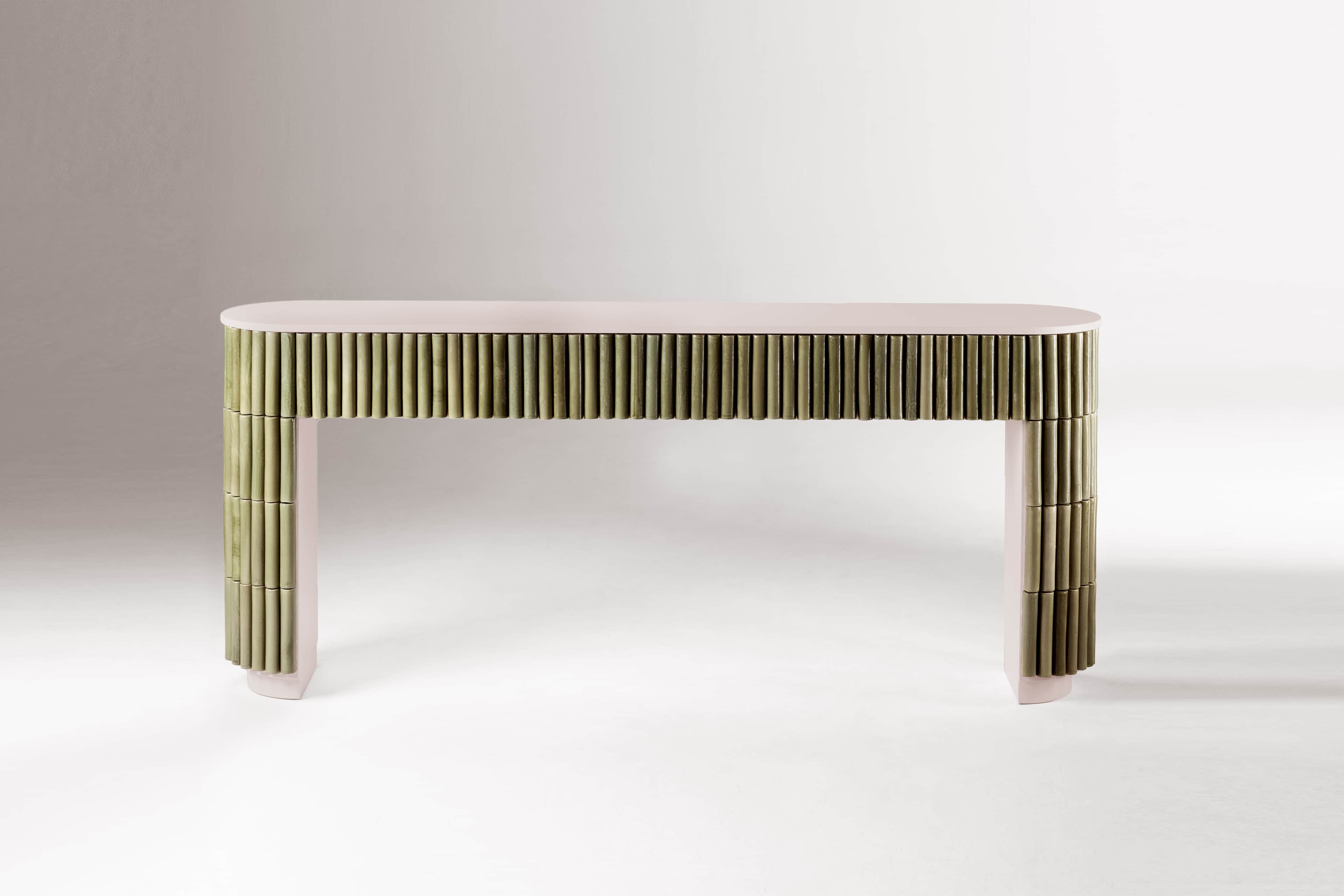 An elongated, narrow console table featuring a light pinkish-beige top and structural elements. The… — 3D model