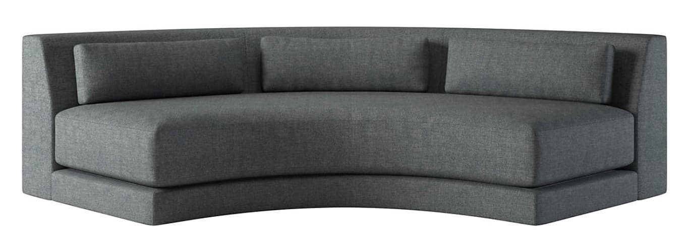 A modern, curved sofa with a low profile. The sofa is upholstered in a textured, dark gray fabric and features a built-in base. It includes three rectangular cushions along the back, two of which appear to be decorative throw pillows and the third a backrest cushion. The overall design is contemporary and minimalist. — 3D model